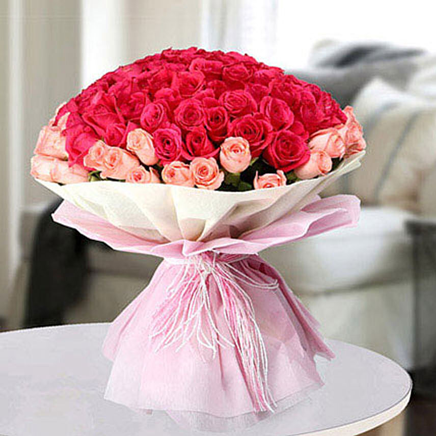باقة 60 وردة جوري لون فوشي ومشمشي في غلاف أنيق: توصيل هدايا المنامة
