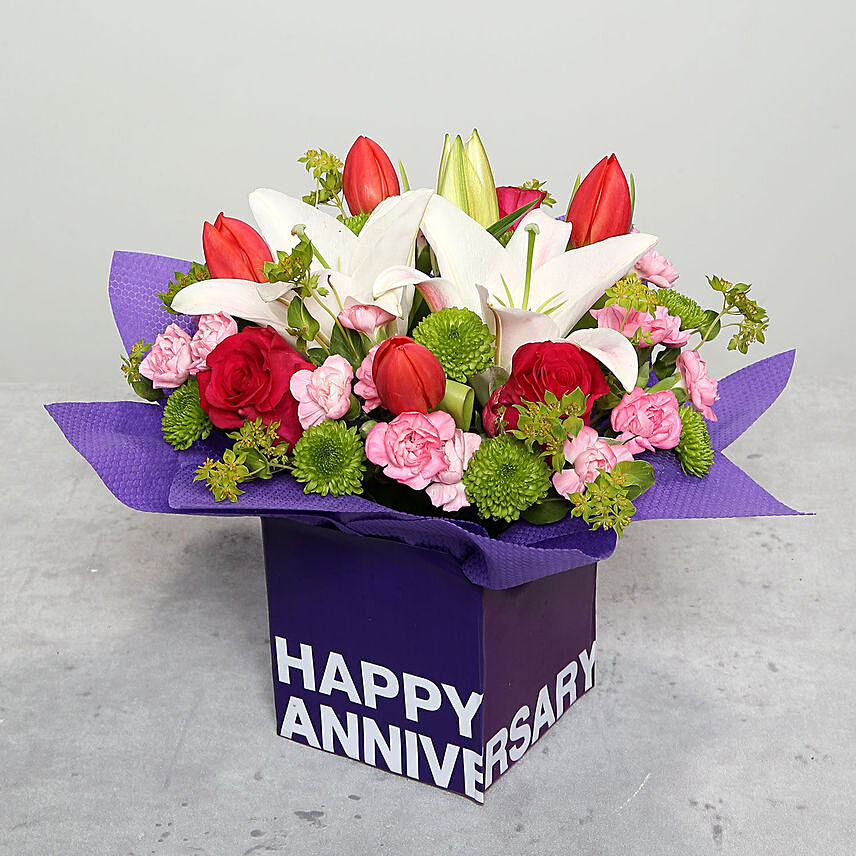 Tulips Roses and Carnations in Glass Vase: Wedding Anniversary Flowers