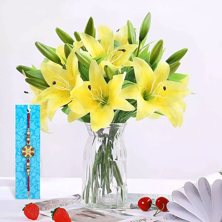 Rakhi With lilies arrangement: Rakhi With Flowers