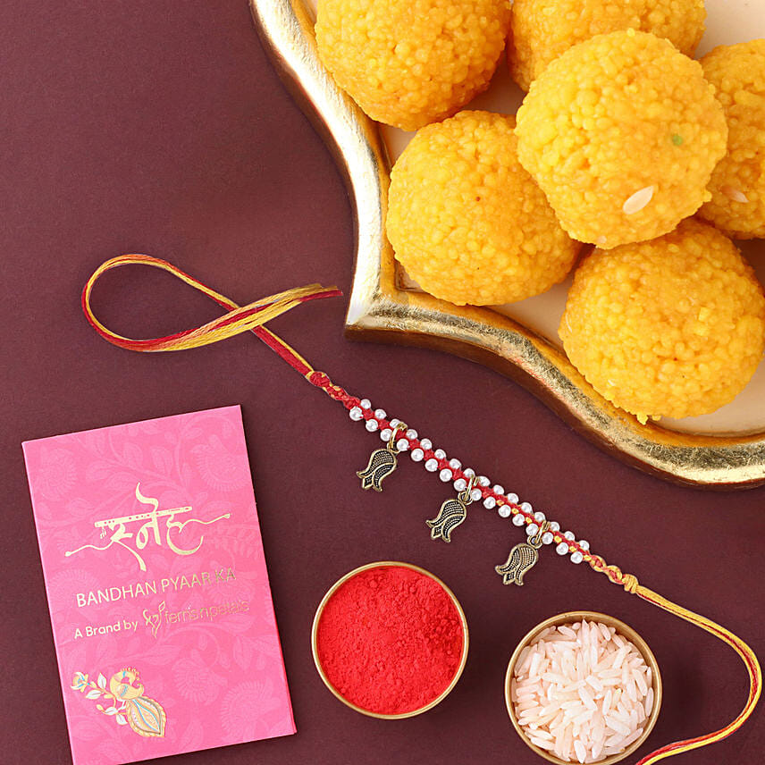 Sneh Feng Shui Beads Rakhi & Motichoor Laddoos: Mauli Rakhi