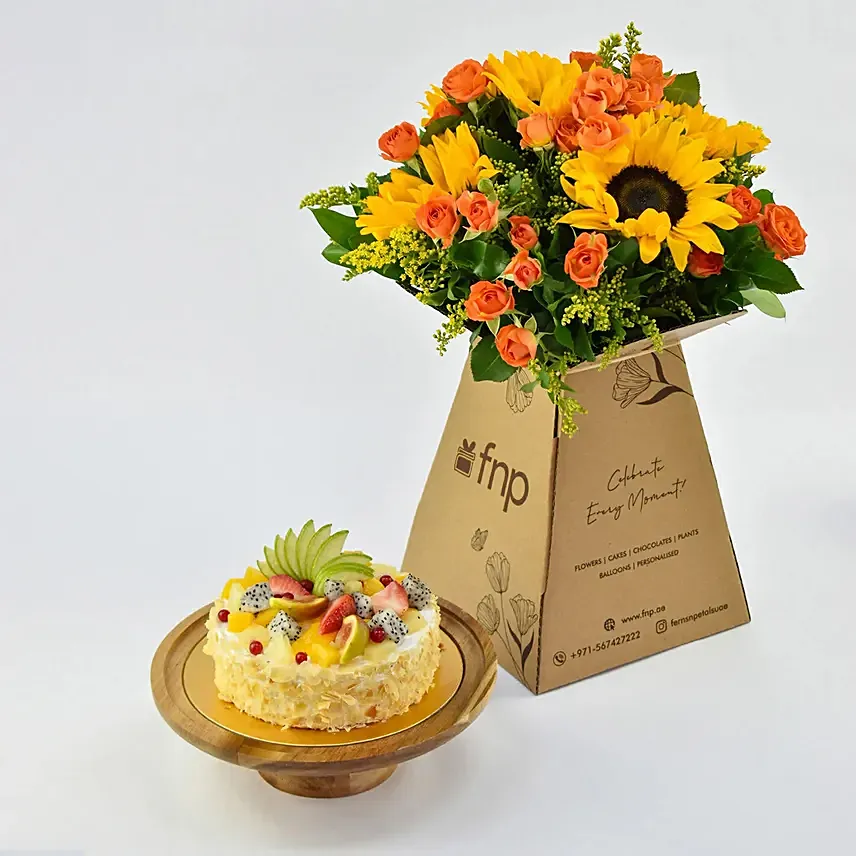 كومبو باقة عباد الشمس وورد برتقالية مع كيك نباتي بالفواكه: توصيل هدايا في عجمان