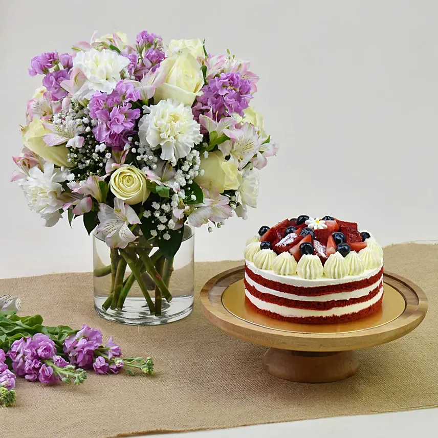 1 Kg Red Velvet Cake With Pink Floral Arrangement: Mothers Day Gifts in Abu Dhabi