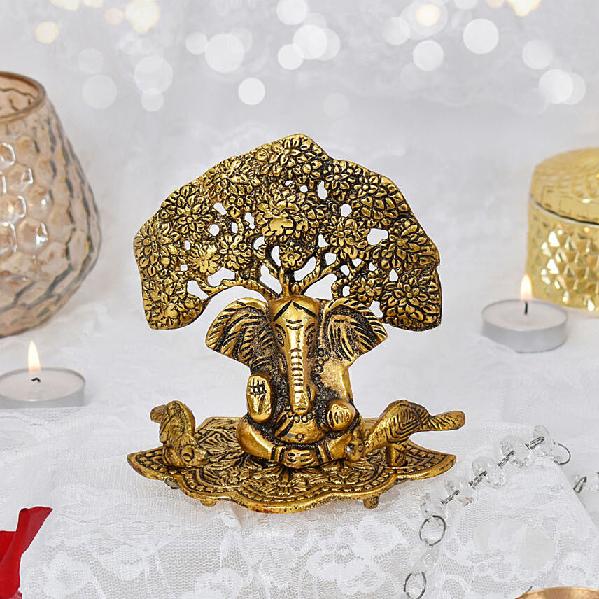 Beautiful Metal Ganesha Idol with Tree: هدايا التماثيل عبر الإنترنت