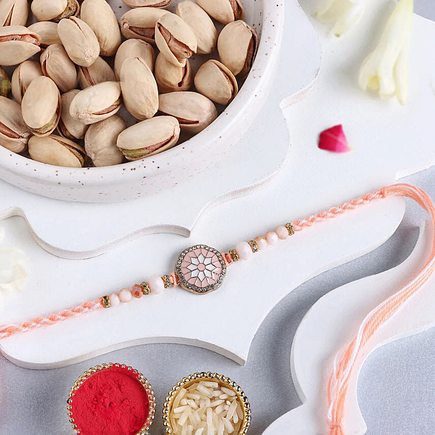 Rosy American Diamond Rakhi N Pistachio Combo: Rakhi With Dryfruits 