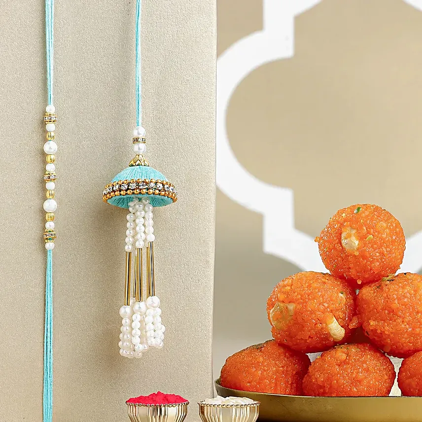 Tranquil Teal Jhumar Bhaiya Bhabhi Pearl Rakhi Set N Ladoo Combo: Lumba Rakhi