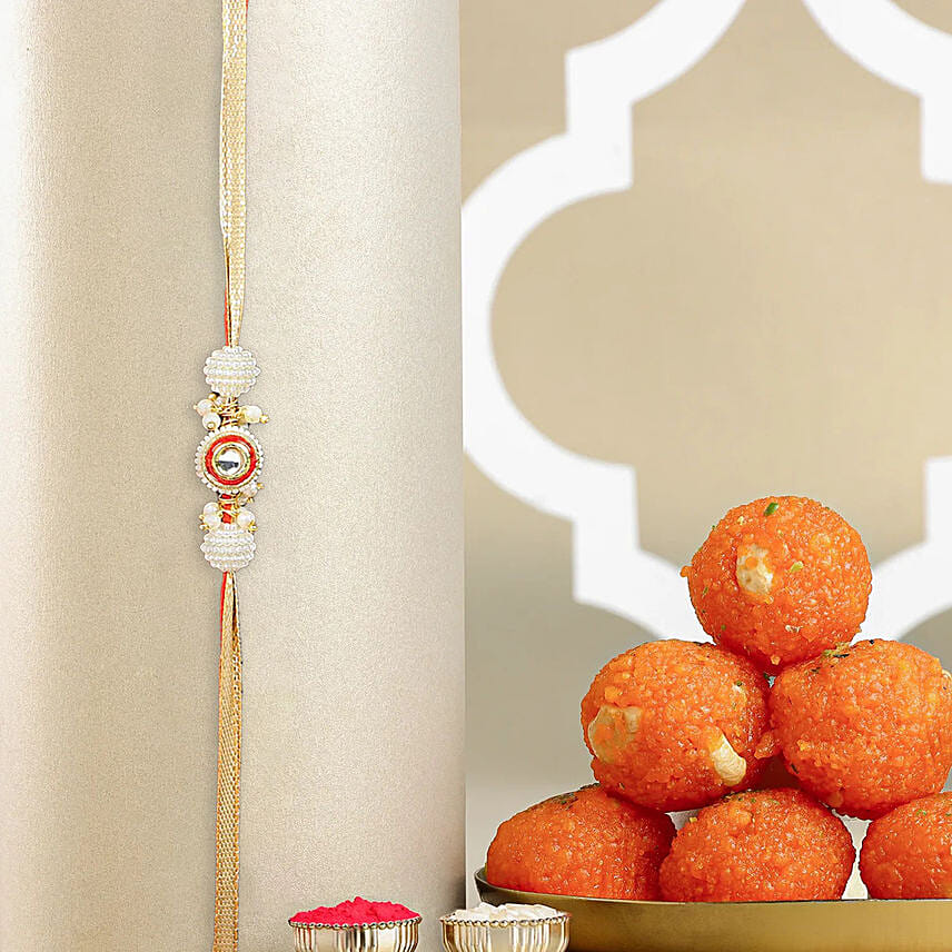 Crimson Majestic Pearl Rakhi N Motichoor Laddoo: Rakhi with Sweets
