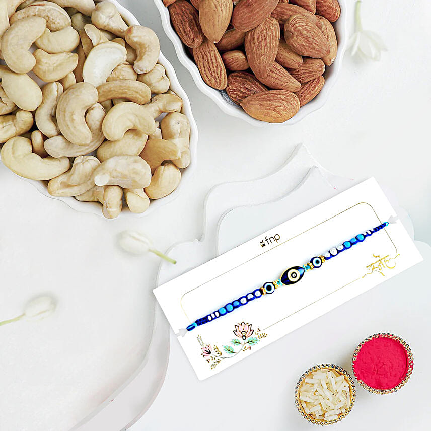 Galactic Blue Protector Evil Eye Rakhi With Almonds and Cashew: Designer Fancy Rakhi