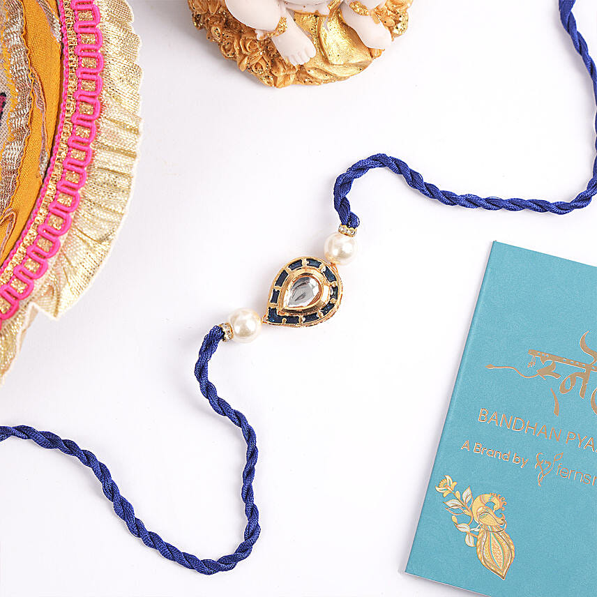 Leaf Shape W blue Thread Rakhi: Rakhi Delivery