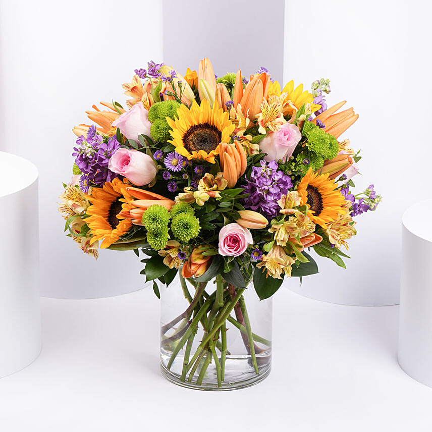 Vibrant Bunch of Flowers In Glass Vase: Mixed Flower Bouquets