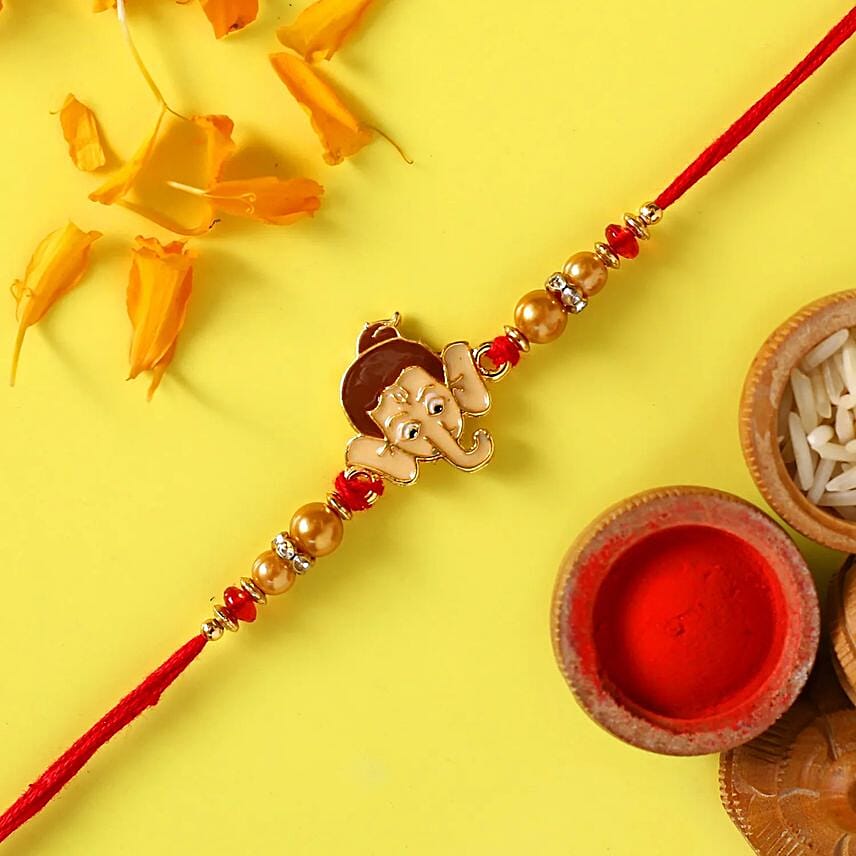 Long Trunk Bal Ganesha Pearl Rakhi For Kids With 3 Ferrero Rocher: Rakhi In Dubai