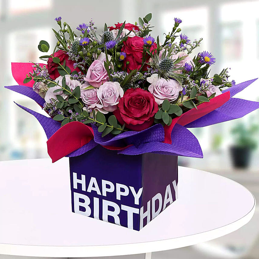 Mixed Flowers In Square Glass Vase: Gift Delivery in Qatar