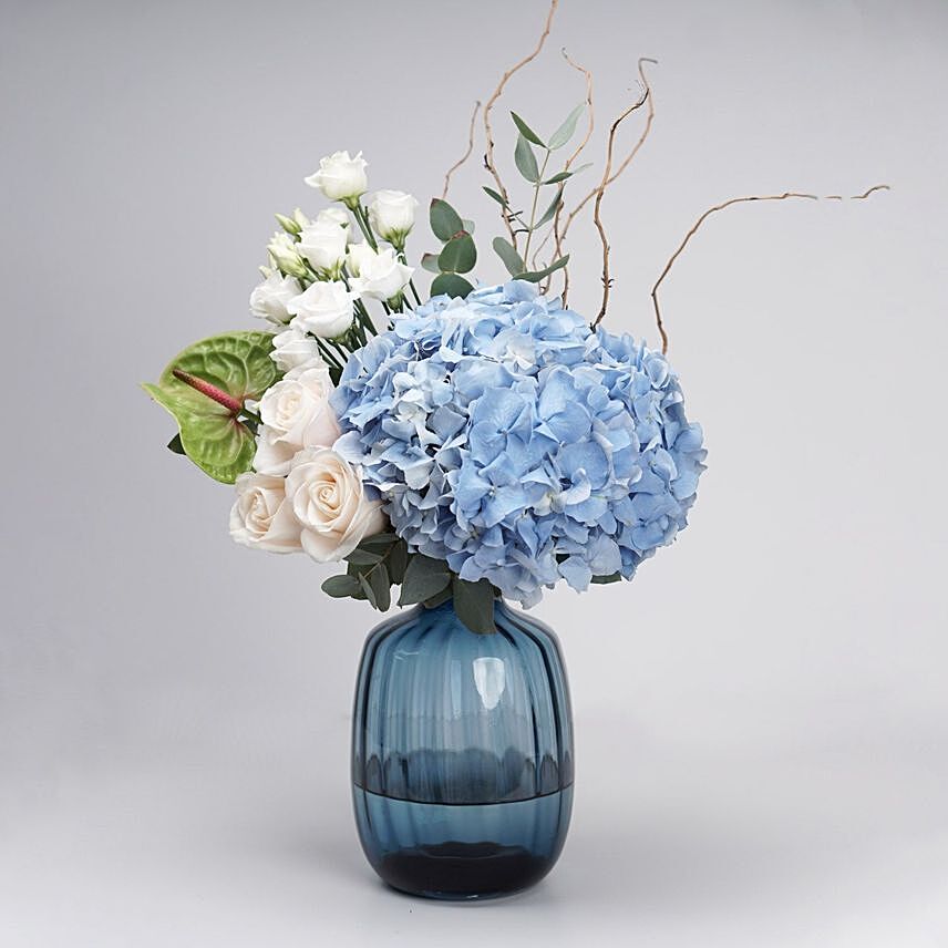 Captivating Mixed Flowers Blue Glass Vase: Send Anniversary Gifts To Qatar