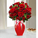 Red Blend Of Roses And Carnation In A Glass Vase