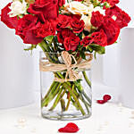 Red and Peach Roses in a Vase
