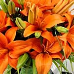 Blissful Orange Lilies In Fishbowl Vase