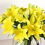 Cheerful Yellow Lilies In Fishbowl Vase