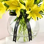 Cheerful Yellow Lilies In Fishbowl Vase