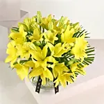 Cheerful Yellow Lilies In Fishbowl Vase