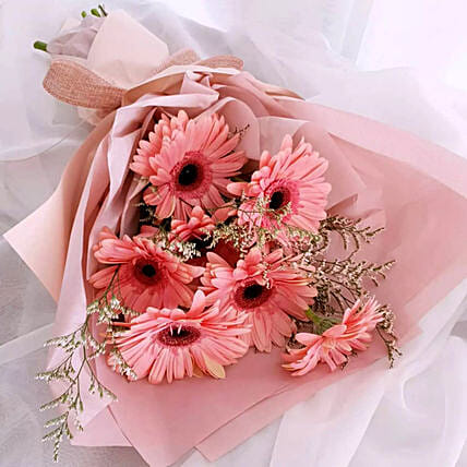 Elegant Pink Gerberas Beautifully Tied Bouquet: Send Anniversary Gifts to Kuwait
