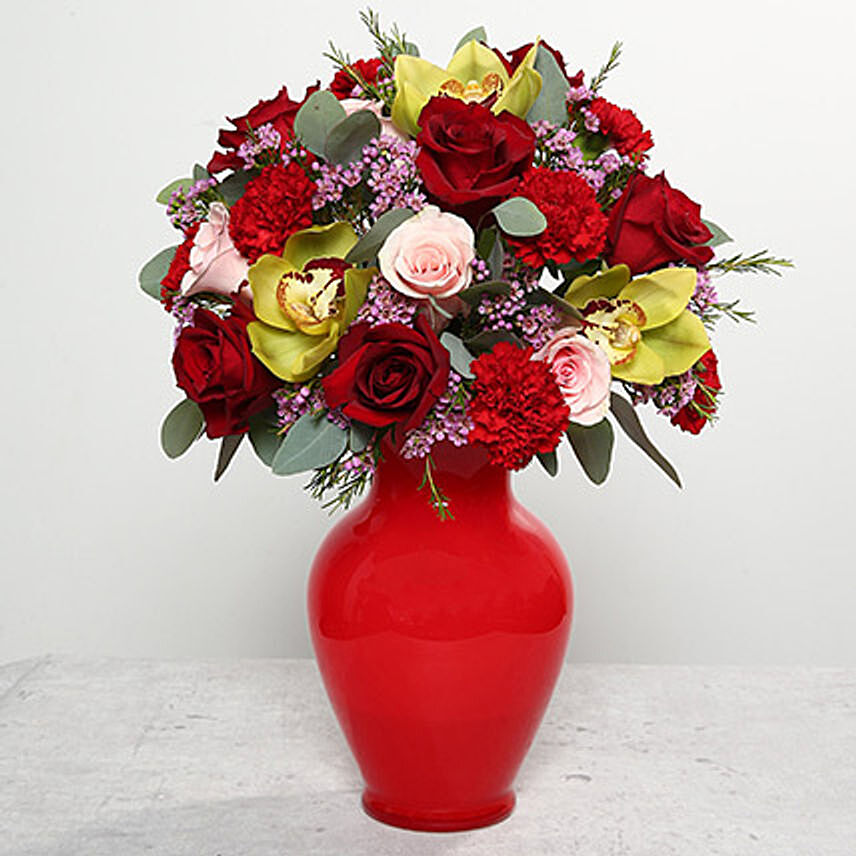 Mixed Flowers In Red Glass Vase