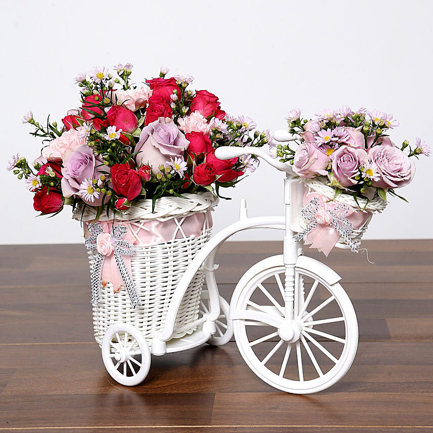 Purple and Pink Flowers In Cycle Basket