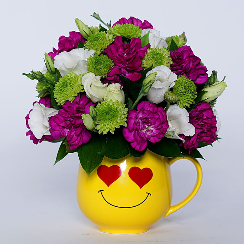Ravishing Mixed Flowers In Smiley Heart Mug