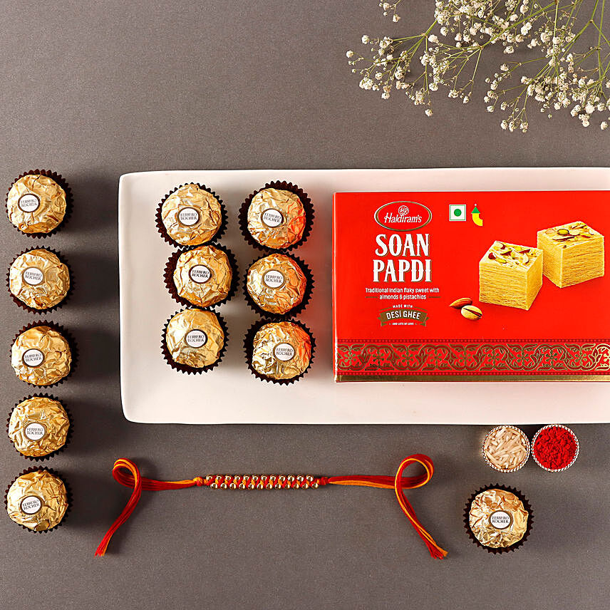 Sneh Gold Mauli Rakhi with 250 Grams Soan papdi and 6 Pcs Rocher