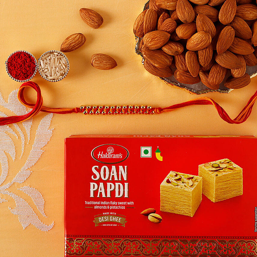 Sneh Gold Mauli Rakhi with 250 Grams Soan papdi and Almonds