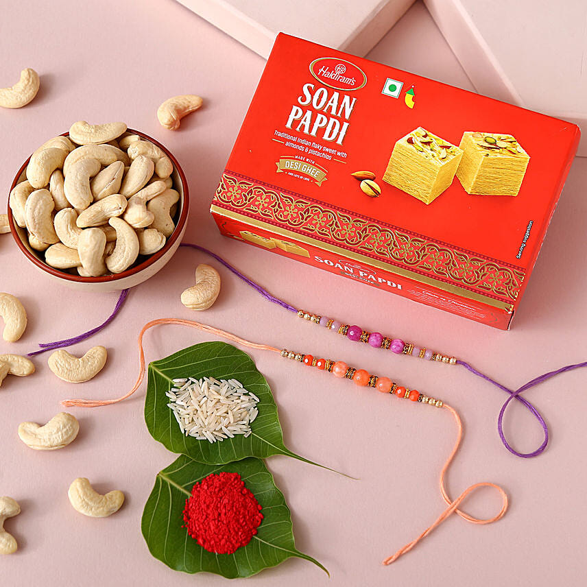 Sneh Peachy Rakhi Set with 250 Grams Soan Papdi and Cashew