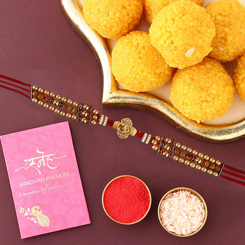 Sneh Shimmering Om Rakhi With Mothichoor Laddoos