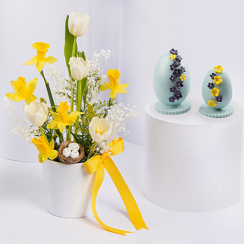Ester Eggs In Flower Arrangement And Easter Chocolates