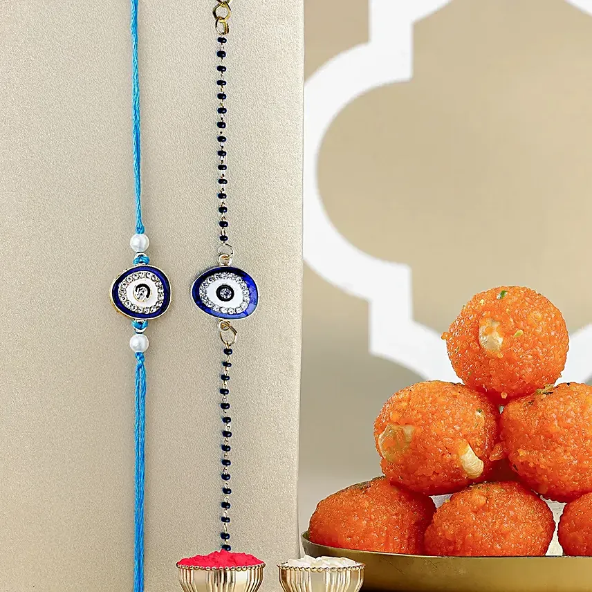 Feng Shui Guardian Evil Eye Bhaiya Bhabhi Rakhi And Motichoor Ladoo: Rakhi for Bhaiya Bhabhi