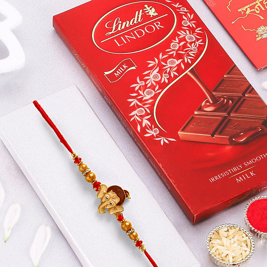 Long Trunk Bal Ganesha Pearl Rakhi For Kids And 1 Lindt Chocolate: Rakhi Gifts 