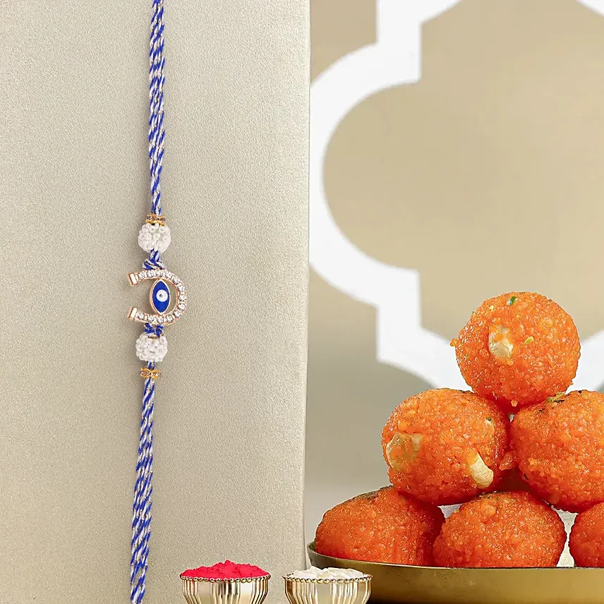 Evil Eye Charm Rakhi And Motichoor Ladoo: Set of 2 Rakhi