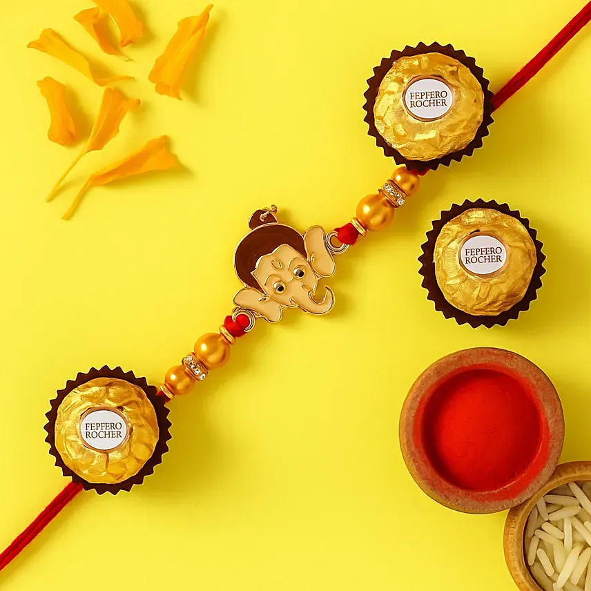 Long Trunk Bal Ganesha Pearl Rakhi For Kids With 3 Ferrero Rocher: Rakhi for Kids 