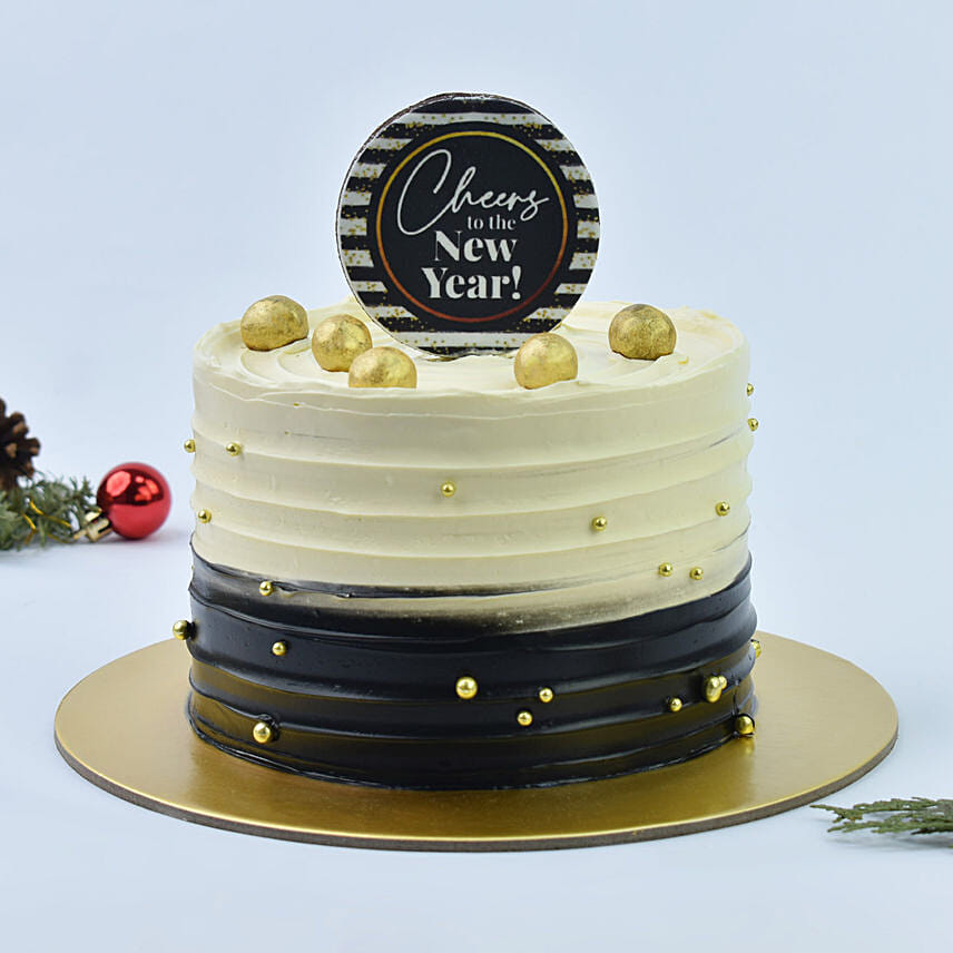 New Year cake with topper that say cheers to the New Year!