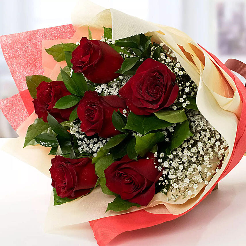 1 Kg Butterscotch Cake with Red Roses Bouquet