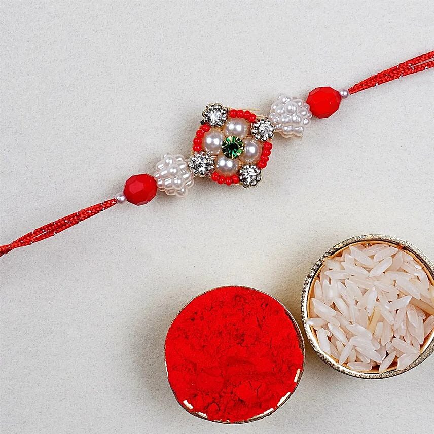 Appealing Floral Rakhi Set With Gulab Jamun And Dry Fruits