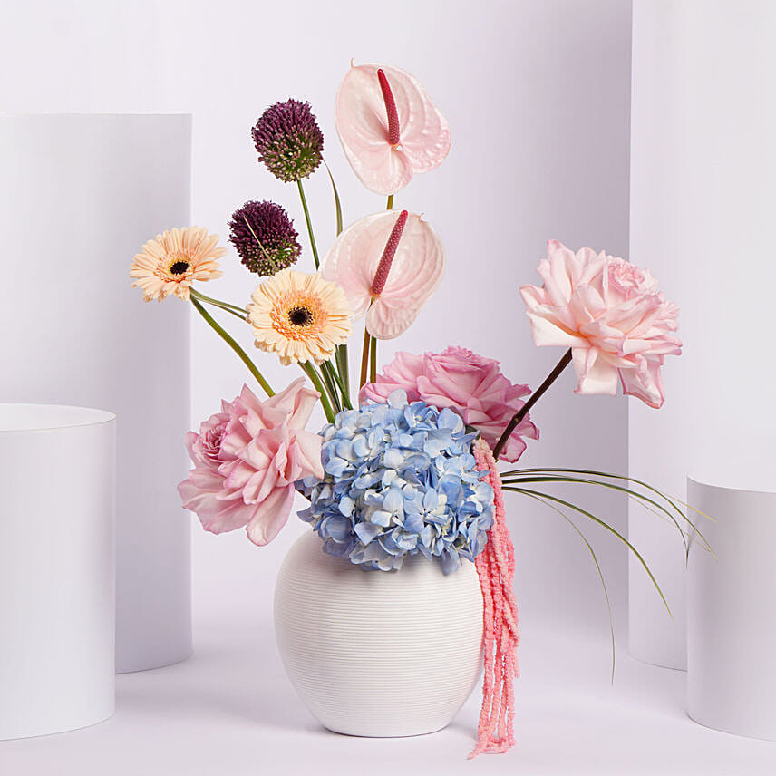 Colorful Flower Arrangement in White Vase