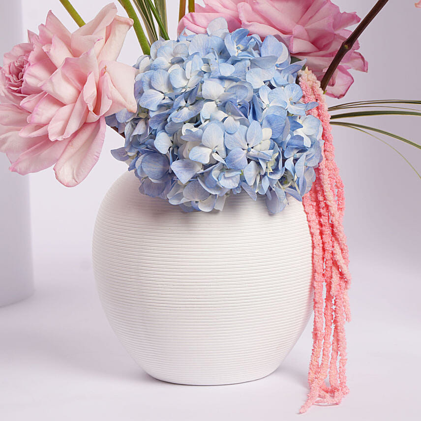 Colorful Flower Arrangement in White Vase