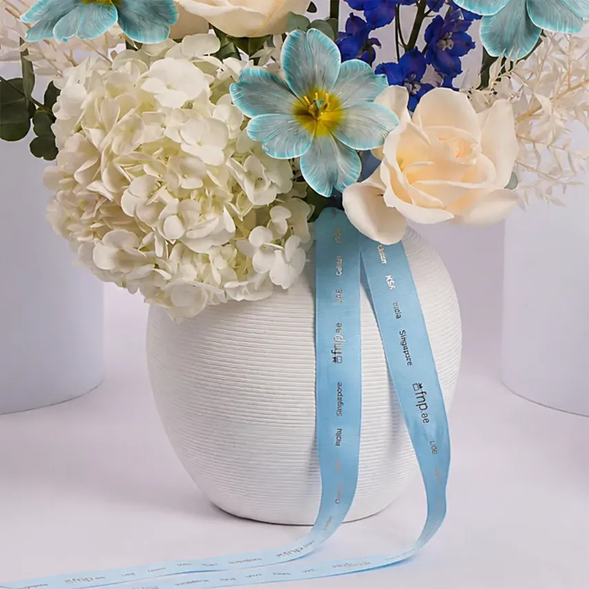 Elegant Blue and White Flower Arrangement in Ceramic Vase