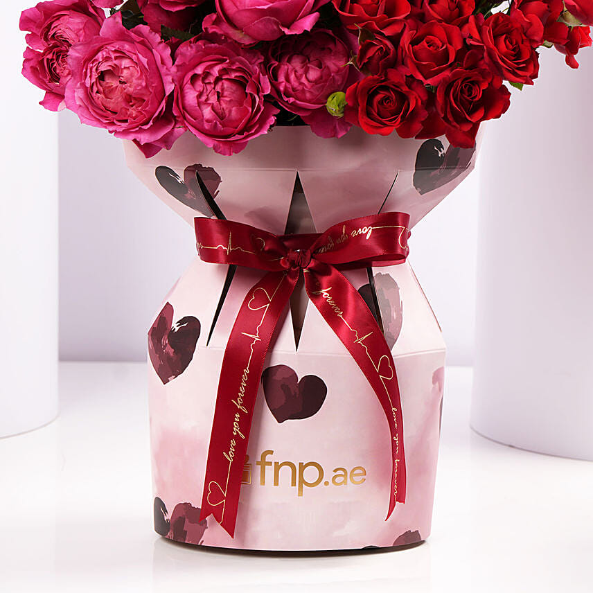 Elegant Mixed Roses In Pink Heart Sleeve