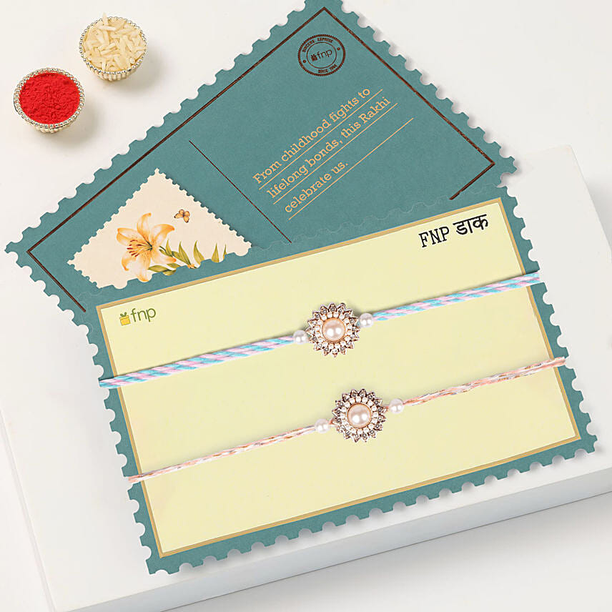 Pearl Floral Rakhi Set Of 2 With Half Kg Chocolate Cake