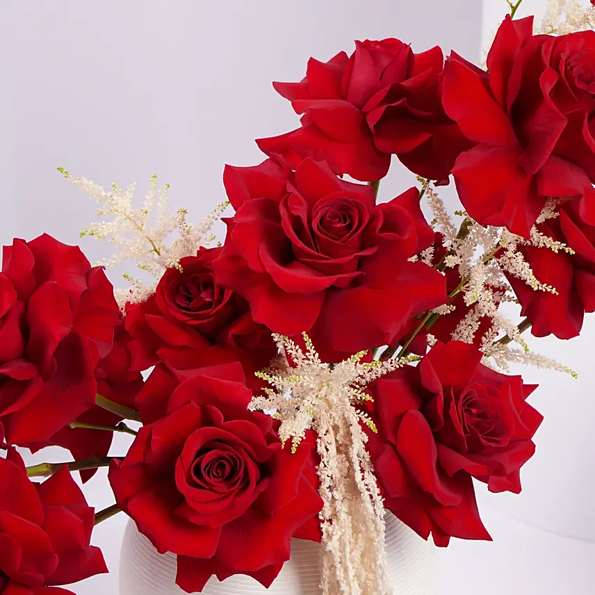 Red Rose Flower Arrangement in White Ceramic Vase