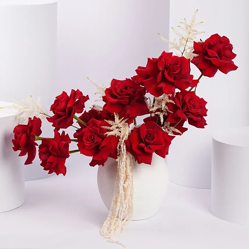 Red Rose Flower Arrangement in White Ceramic Vase
