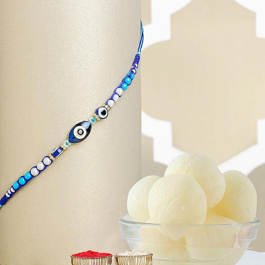 Galactic Blue Protector Evil Eye Rakhi with Rasgulla Tin Galactic Blue Protector Evil Eye Rakhi with Rasgulla Tin: Rakhi for Kids