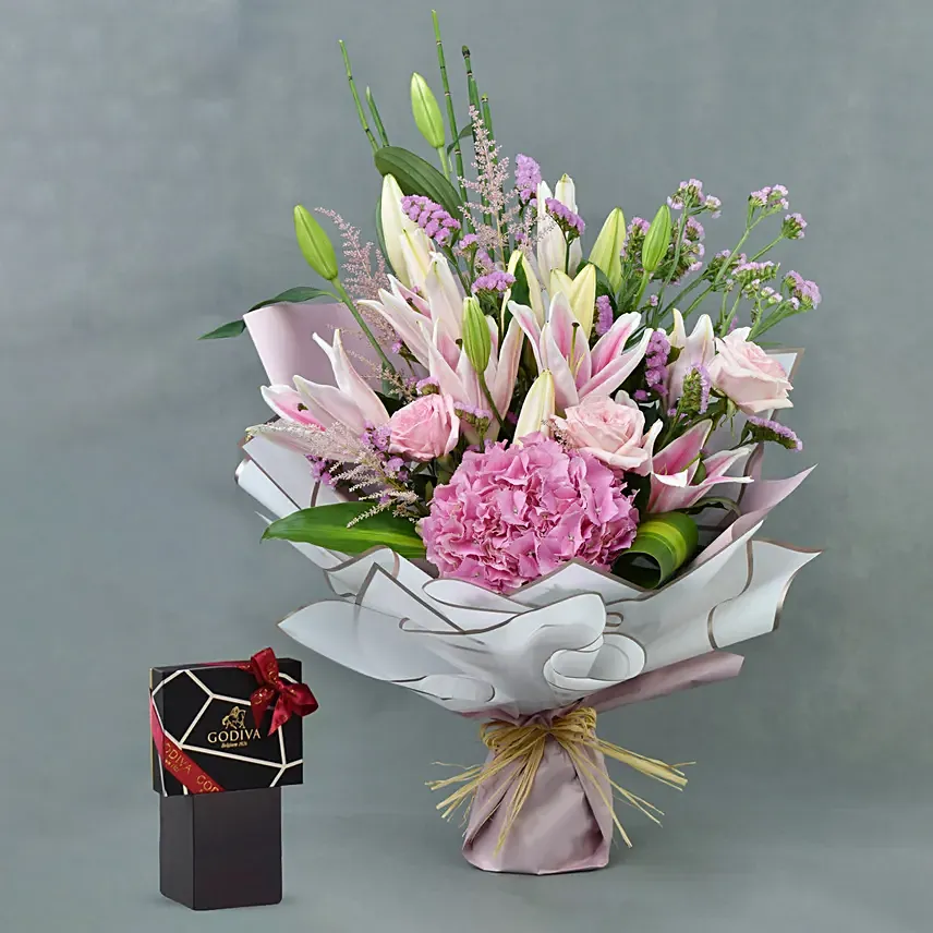 باقة ورد زنبق مشكل زهر مع شوكولاته جوديفا باقة ورد زنبق مشكل زهر مع شوكولاته جوديفا: باقة ورد مع شوكولاته عيد الميلاد