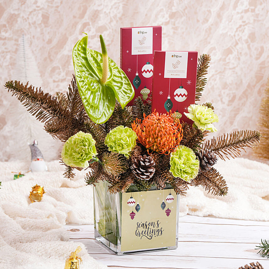 باقة ورد و شوكولاتة فرحة الأعياد باقة ورد و شوكولاتة فرحة الأعياد: تنسيق هدايا الكريسماس