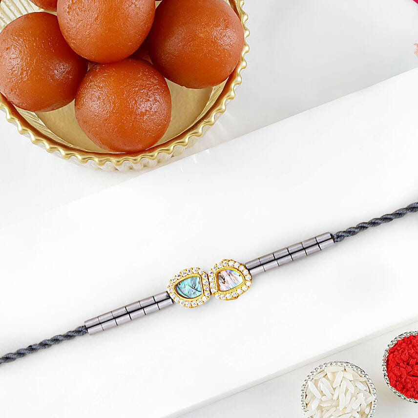 Regal Crest Beads Rakhiand 1 Kg Gulab Jamun: Rakhi with Sweets