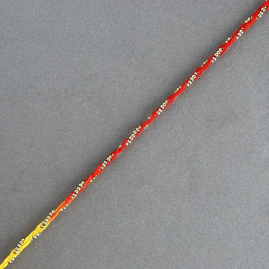 Sacred Bead Work Mauli Rakhi And 24 Pcs Ferrero Rocher Sacred Bead Work Mauli Rakhi And 24 Pcs Ferrero Rocher: Rakhi in Ajman